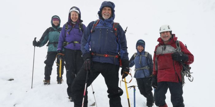Mynydd members victorious at top of Number four gully in white-out conditions on Ben Nevis
